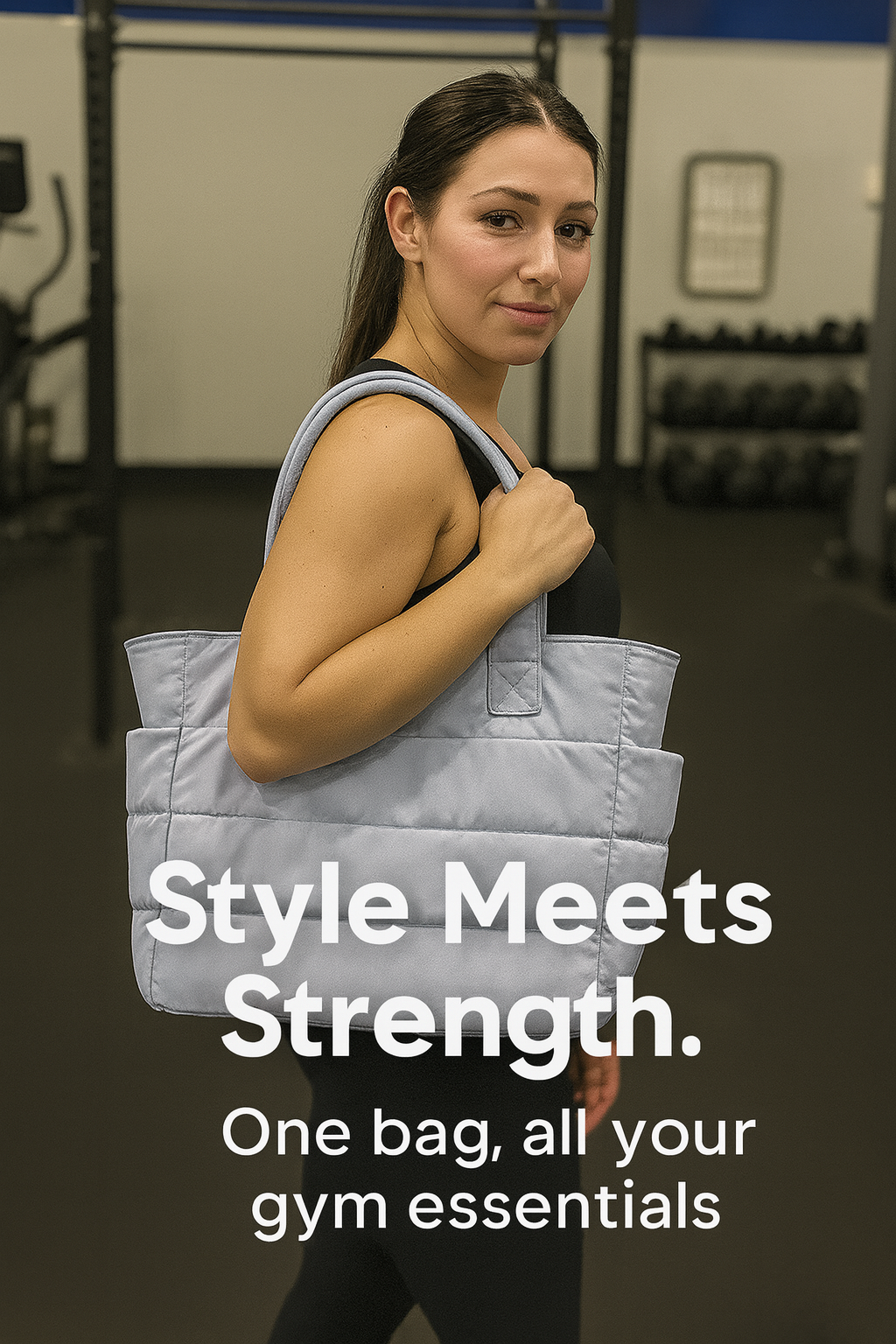 Woman holding a gray tote bag in a gym setting with text 'Style Meets Strength.'